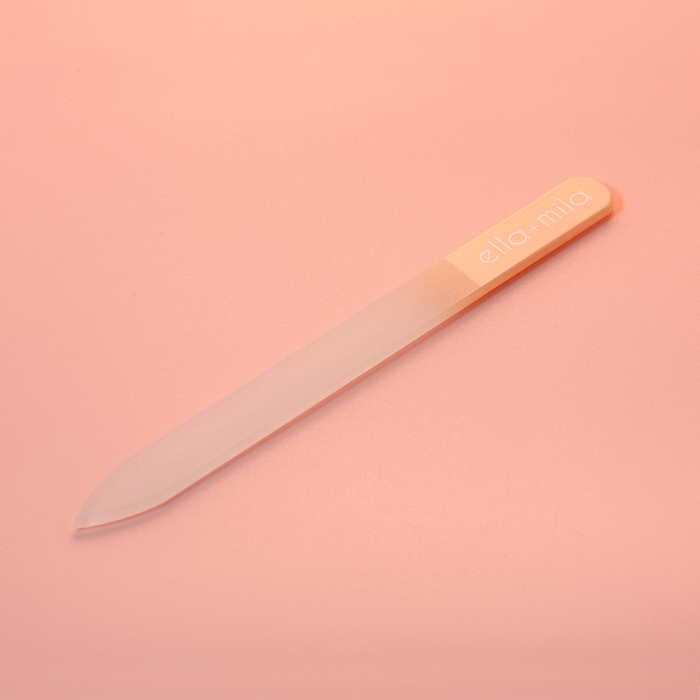 Peach ombre glass nail file on a peach background